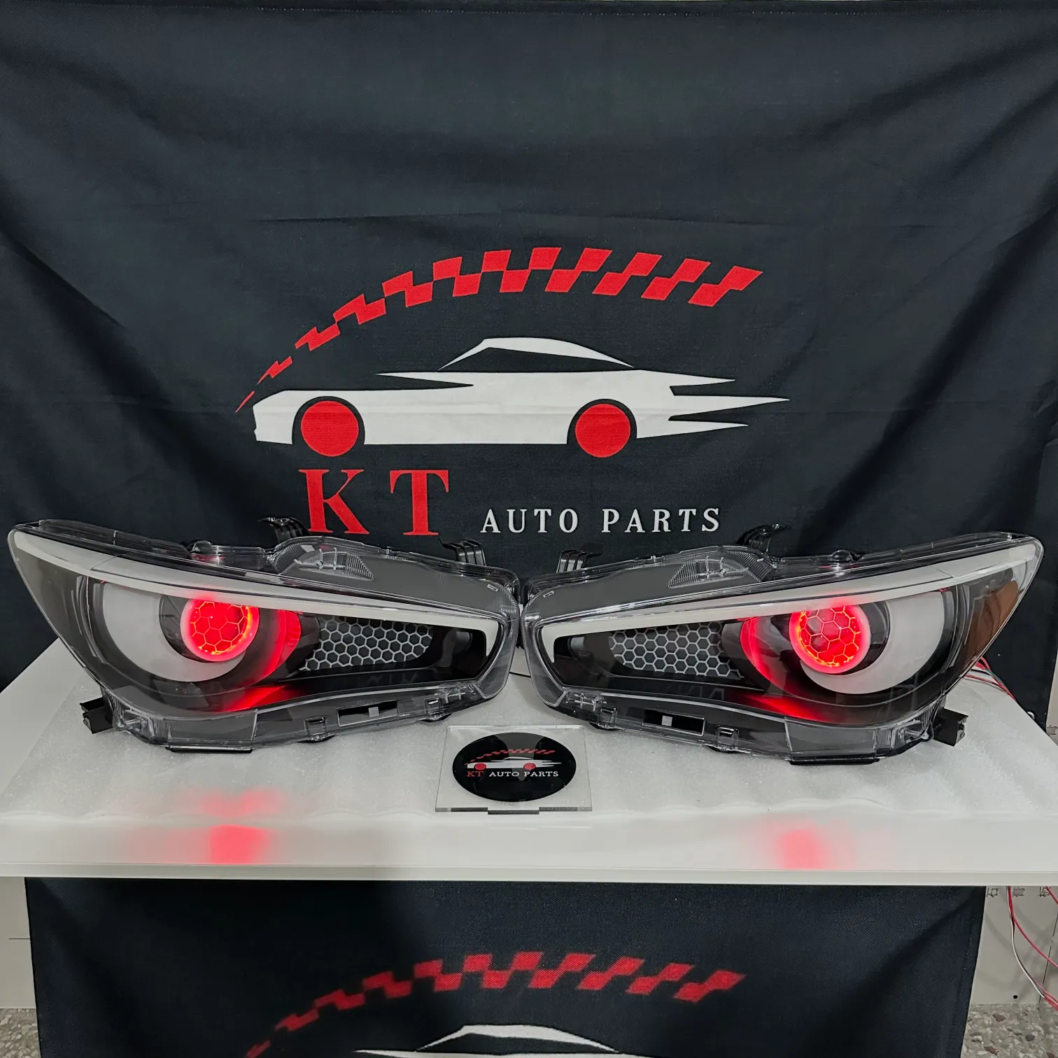 Blacked-out Infiniti Q50 custom headlights with bright red evil demon eye projector lens