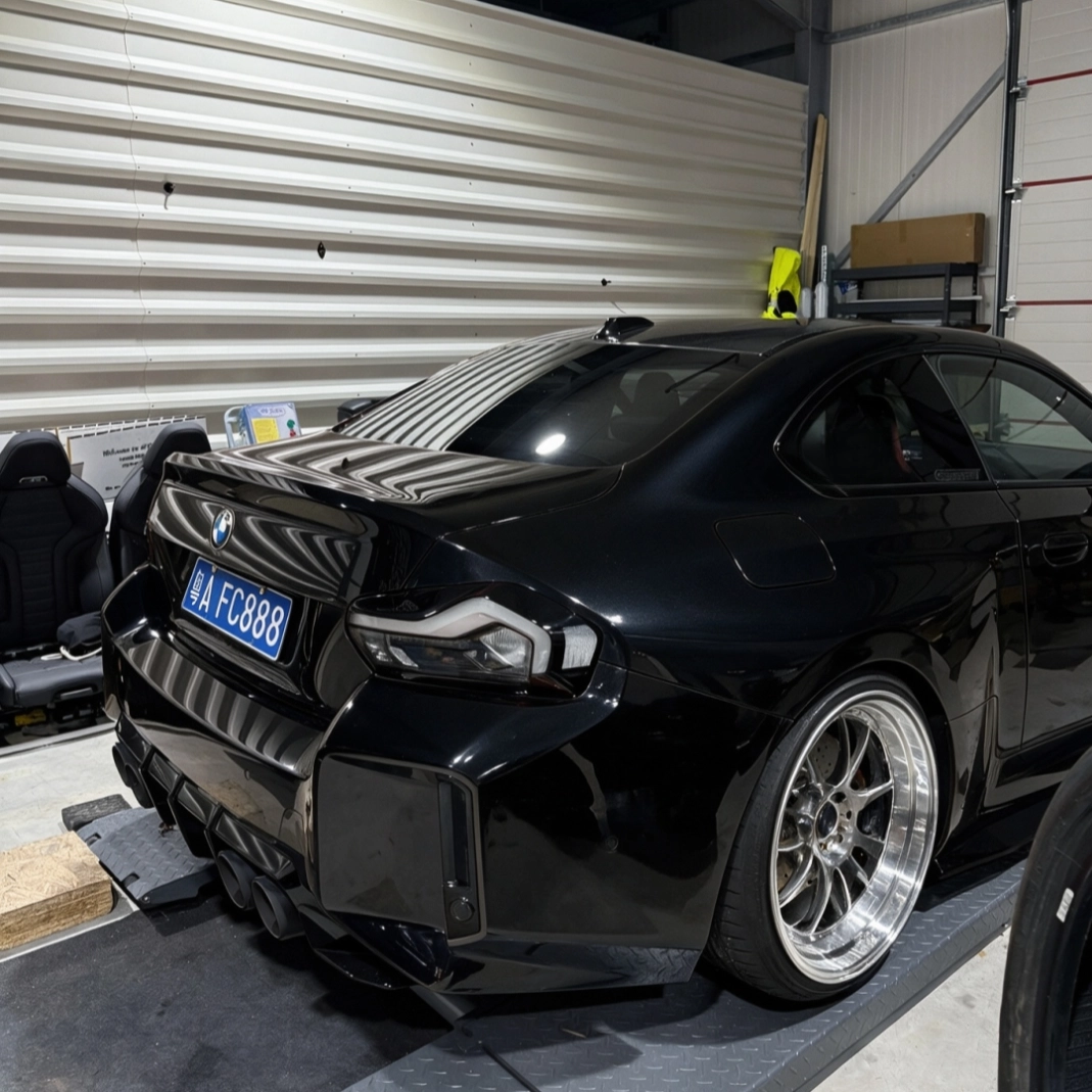 BMW G87 M2 Black Venom Taillights closeup showing crystal clear lens installed